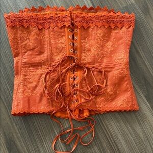 Frederick's of Hollywood orange lace-up corset with scalloped lace trim